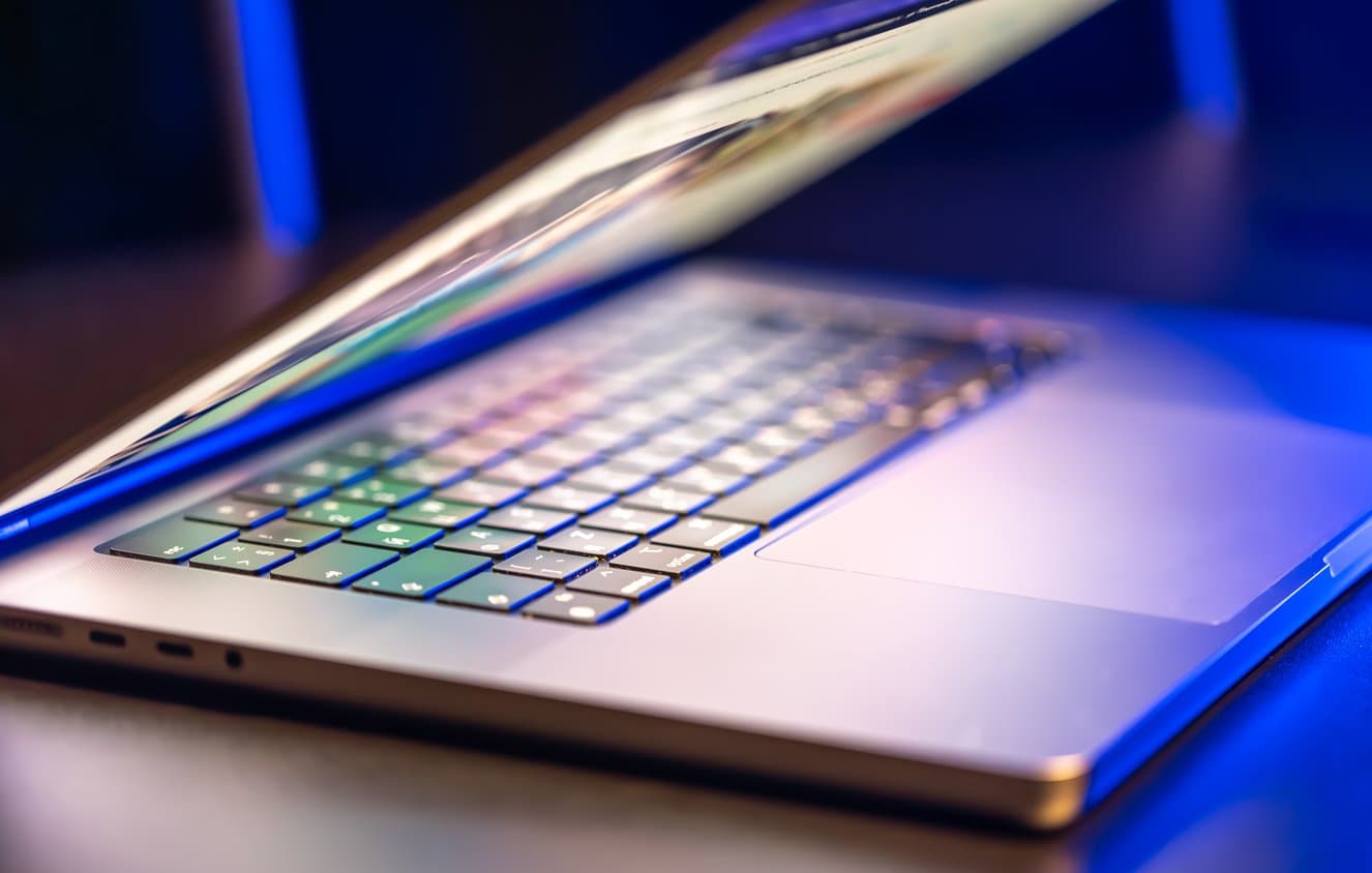 Half-open laptop with a backlit keyboard